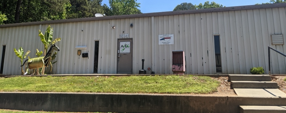 AVEC Automotive Service Center building with Official North Carolina State Inspection Station sign